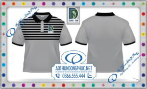 Thêu logo áo thun đồng phục công ty Dũng Tâm. Xưởng may áo thun đồng phục giá gốc áp dụng công nghệ thêu vi tính hiện đại, hình thêu được vẽ mẫu trước khi sản xuất hàng loạt, chỉ cần bấm nút là các đầu thêu tự động của hãng TAJIMA sẽ cho ra những mẫu thêu đẹp, sắc nét, độ bền cao và đồng nhất trên tất cả sản phẩm.Chúng tôi tự hào là nhà cung cấp quần áo đồng phục có thêu logo vi tính giá rẻ nhất toàn quốc.